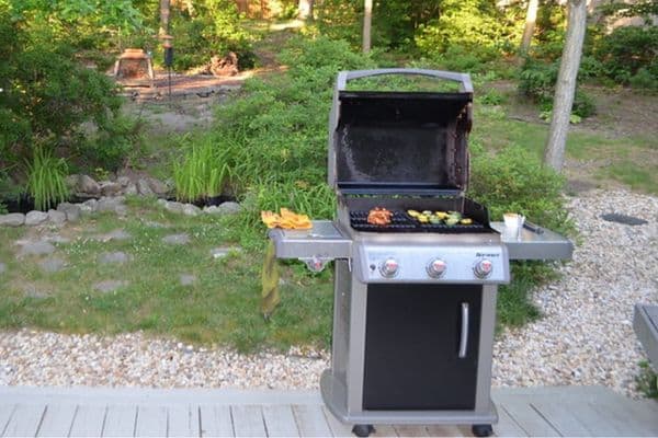 Gas grill outside the house