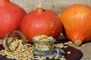 Pumpkin seeds on clear glass