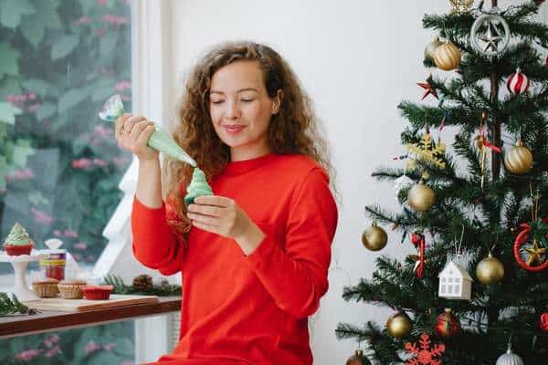 A woman near a christmas tree