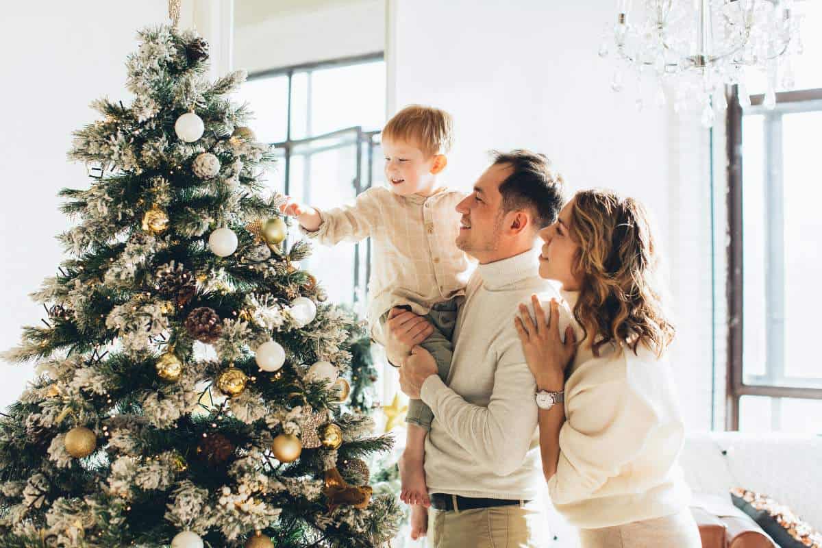 Happy family with a christmas tree