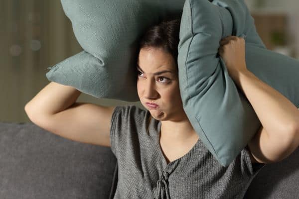 Angry woman suffering neighbor’s noise