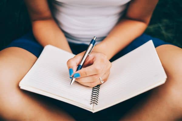 Woman writing notes