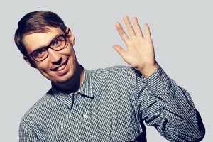 nerdy guy glasses waving