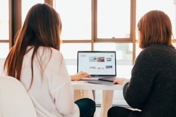 Two women doing office work